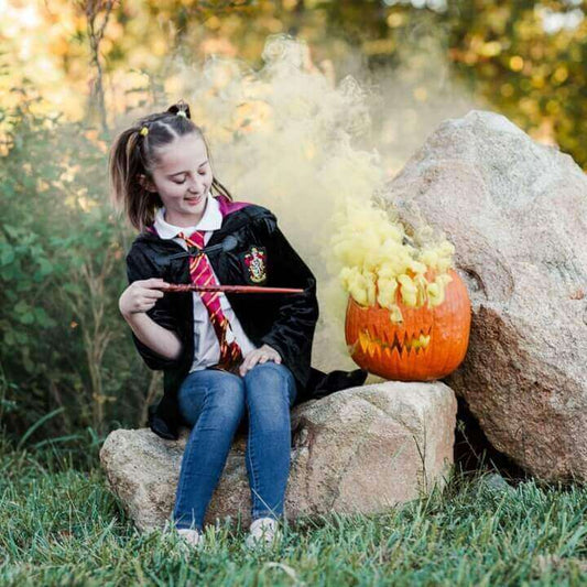 Kids Halloween photo idea with colored smoke outdoors