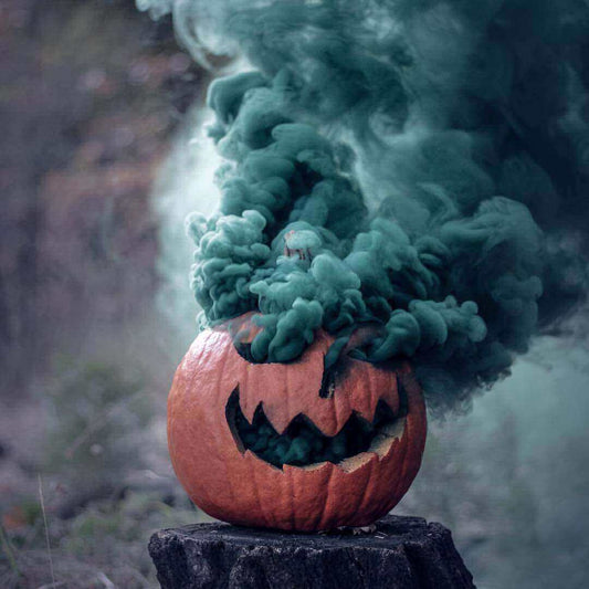 Smoke bomb pumpkin Halloween photo with colored smoke