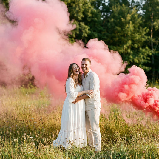 Pink smoke tracing low across a grassy lawn, the kind of visibility that makes gopher exit holes easy to spot