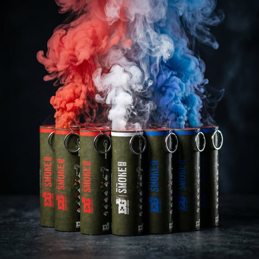Smoke grenades emitting red, white, and blue smoke in a studio setting