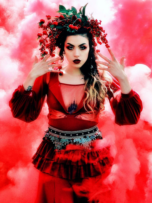 Dramatic fashion portrait wrapped in dense red smoke — real customer photo