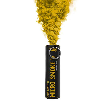 Yellow EG25 smoke grenade emitting dense yellow smoke